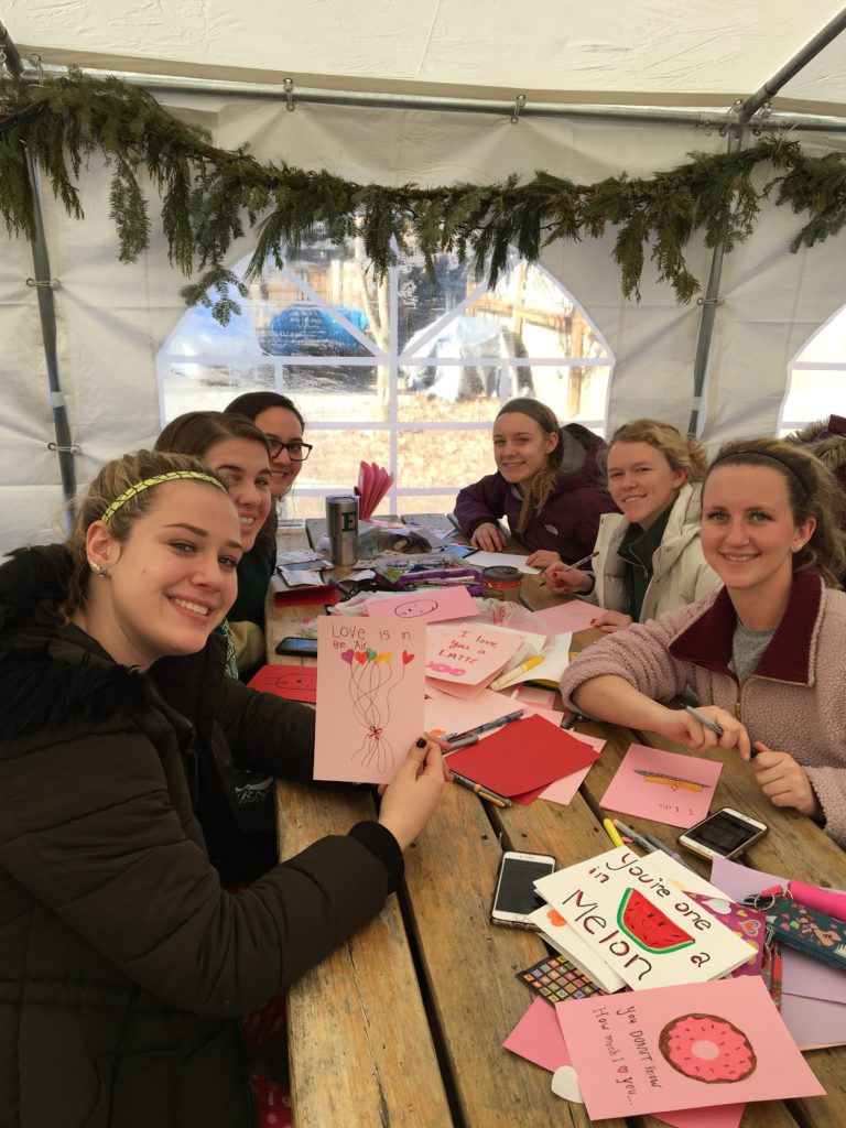 Members of the EMU rowing team spread the love to our local seniors during YMOW's annual card-making event. 